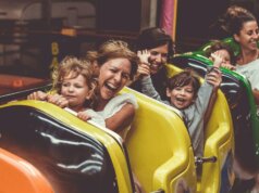 people riding on roller coaster during daytime