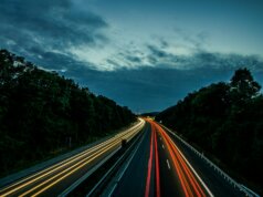 time lapse photography of northbound and southbound lane