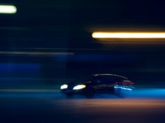 black car on road during night time