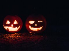 two lighted jack-o-lanterns during night time