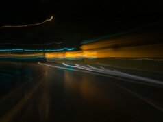 a blurry photo of a street at night