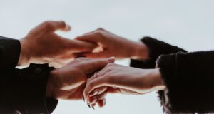 view photography of person hands while holding