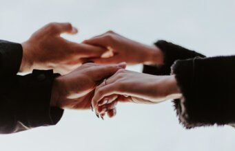 view photography of person hands while holding