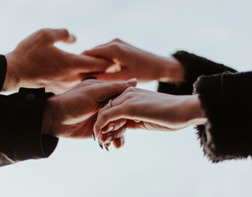 view photography of person hands while holding