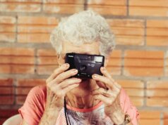 woman holding film camera